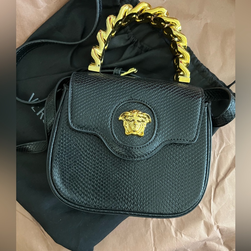 Small black and gold hand bag / crossbody very cute